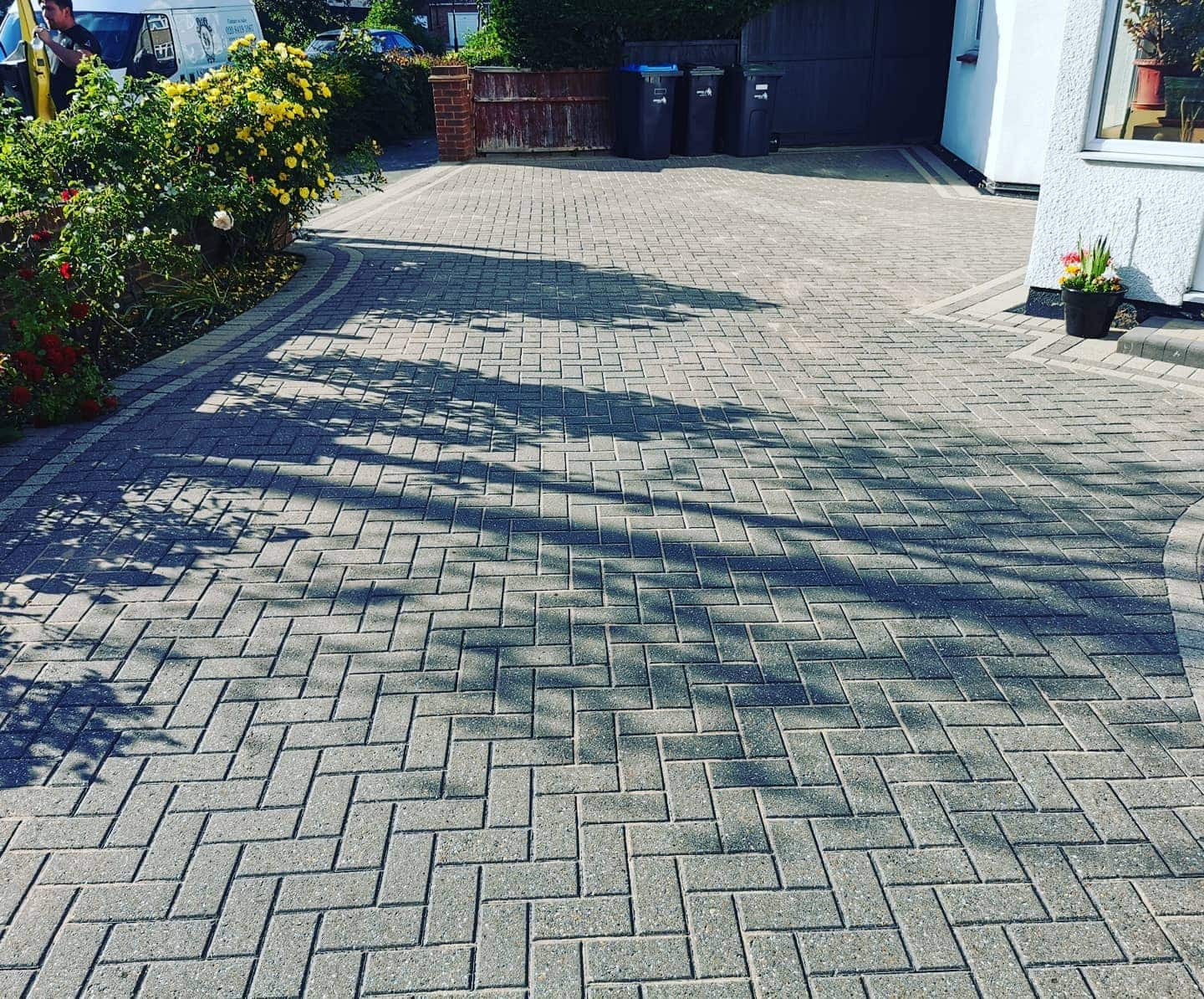 Freshly pressure-washed driveway, bright and weed-free