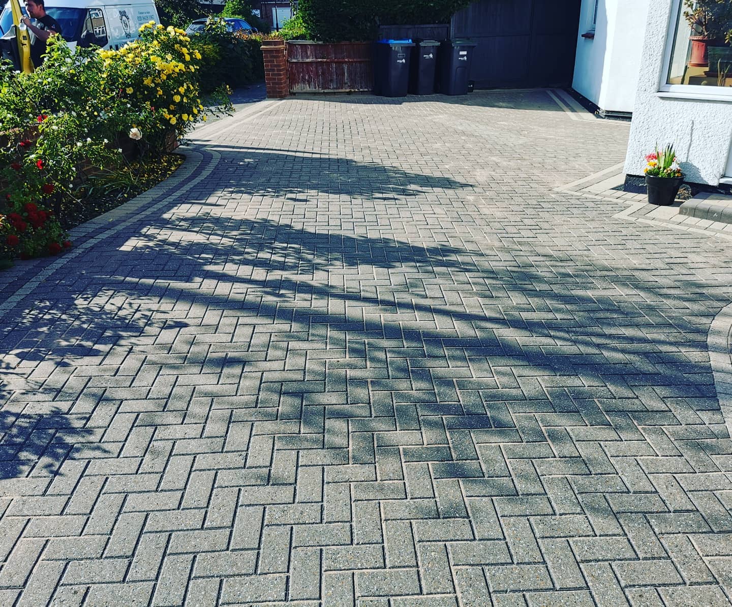 Freshly pressure-washed driveway, bright and weed-free